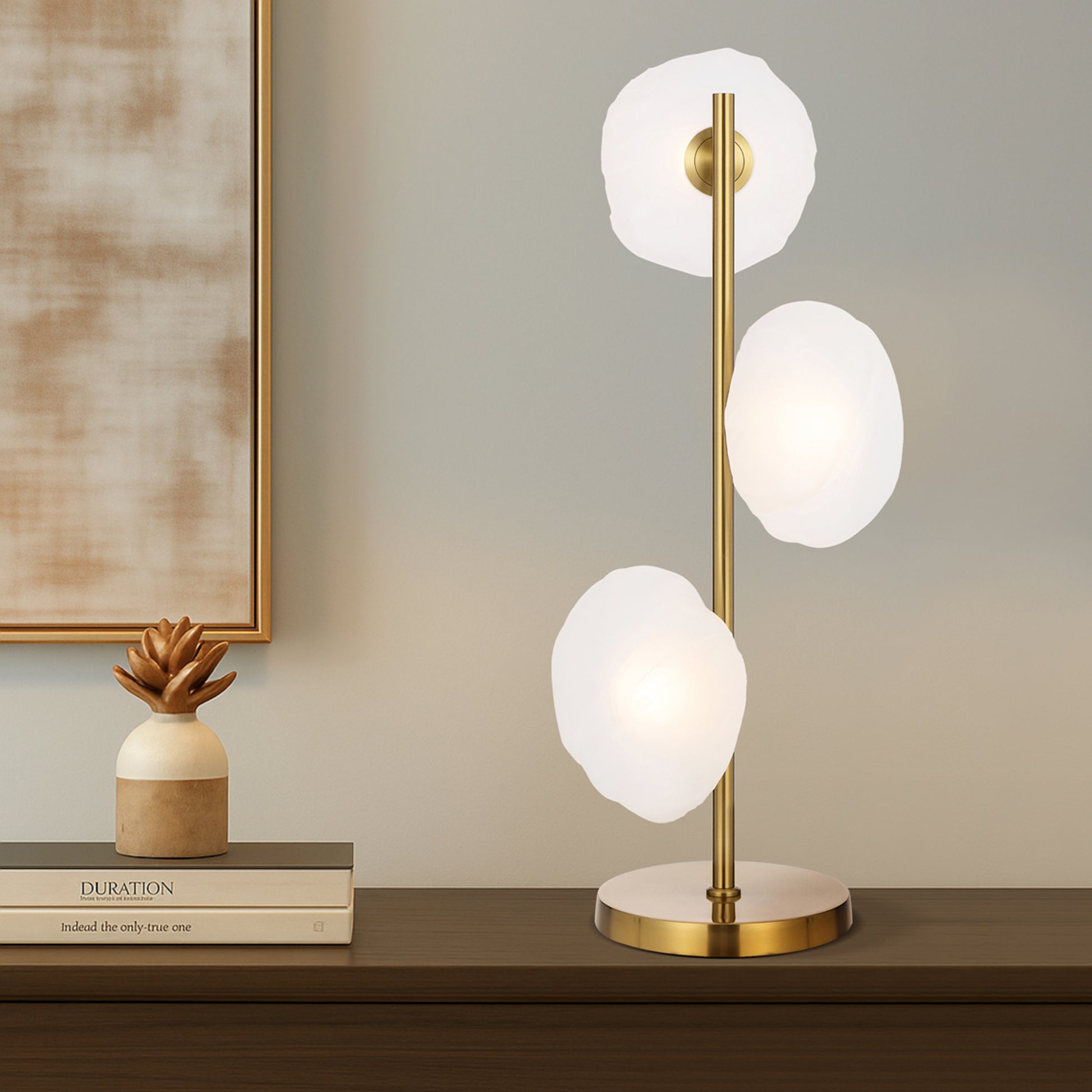 Stylish three-light accent lamp with gold finish and frosted glass