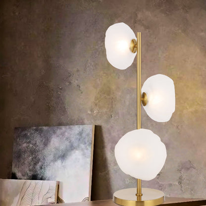 Decorative gold table lamp with three lights and frosted glass design