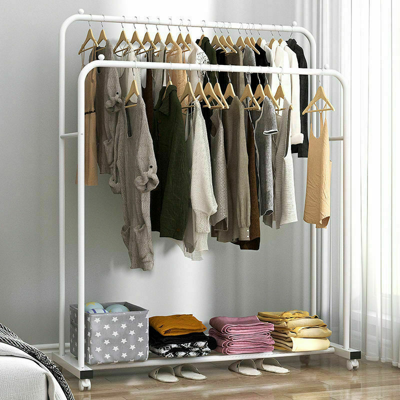 Mobile garment rack holding clothes and shoes