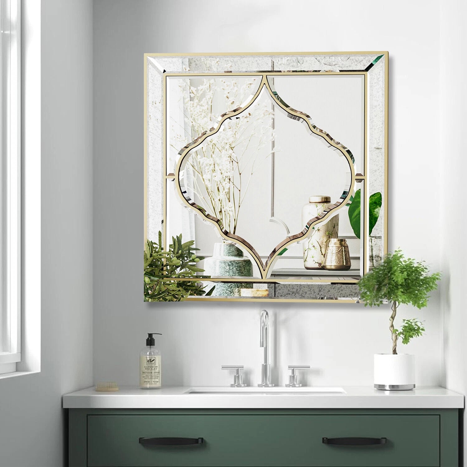 Square wall mirror with golden edge, close-up detail
