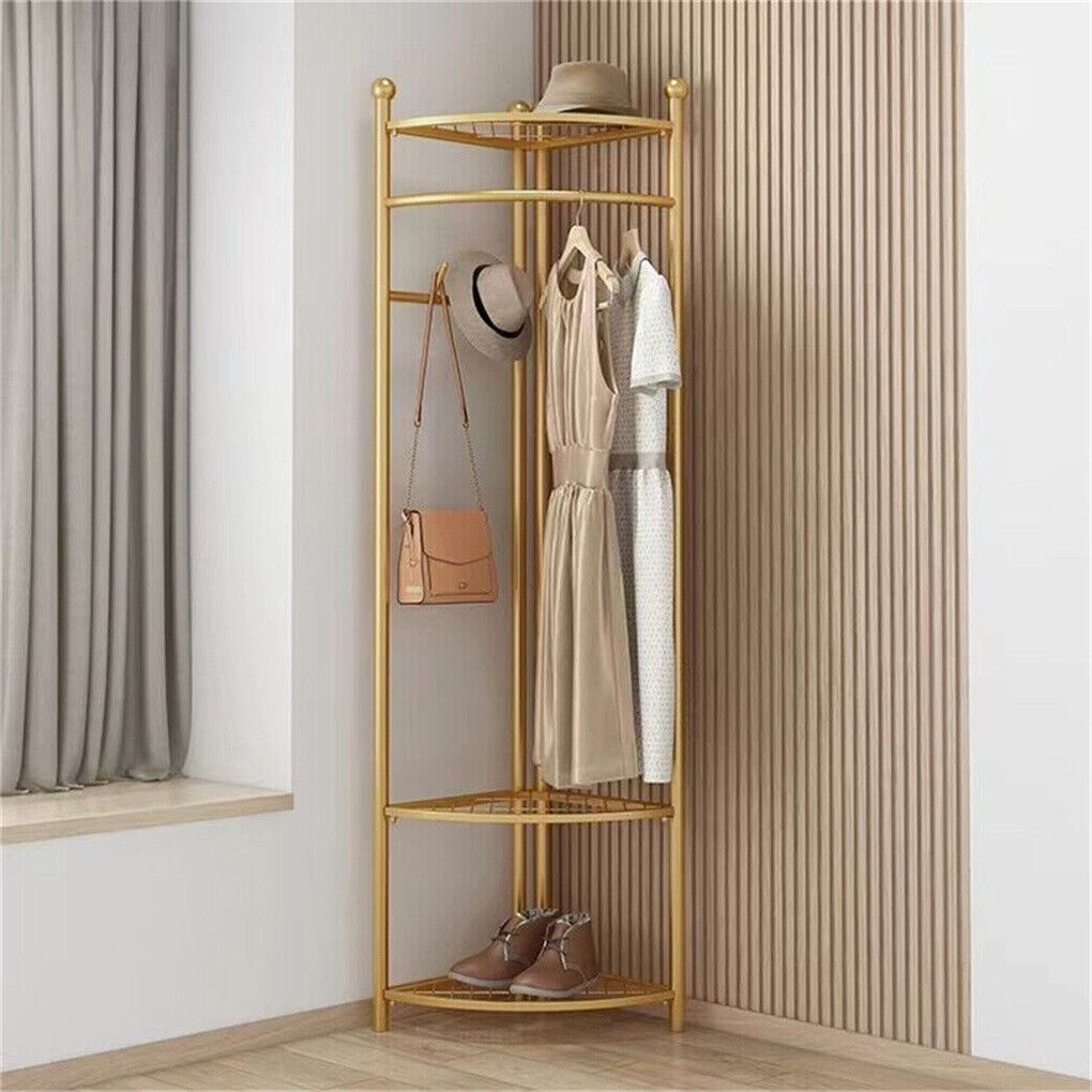 Gold iron coat rack hanging rail and hook detail