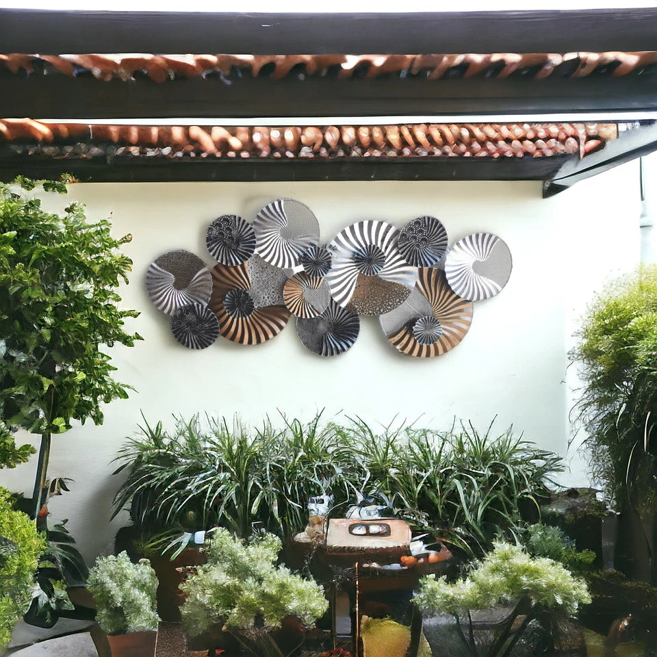 Elegant circular metal wall sculpture with spiral pattern