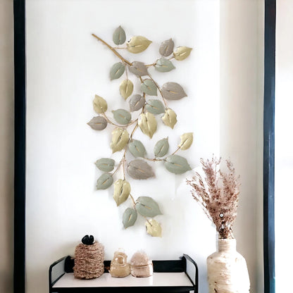 Elegant golden metal wall décor with leaf branch design