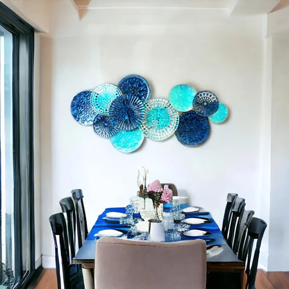 Ocean-inspired blue metal wall décor with circular accents