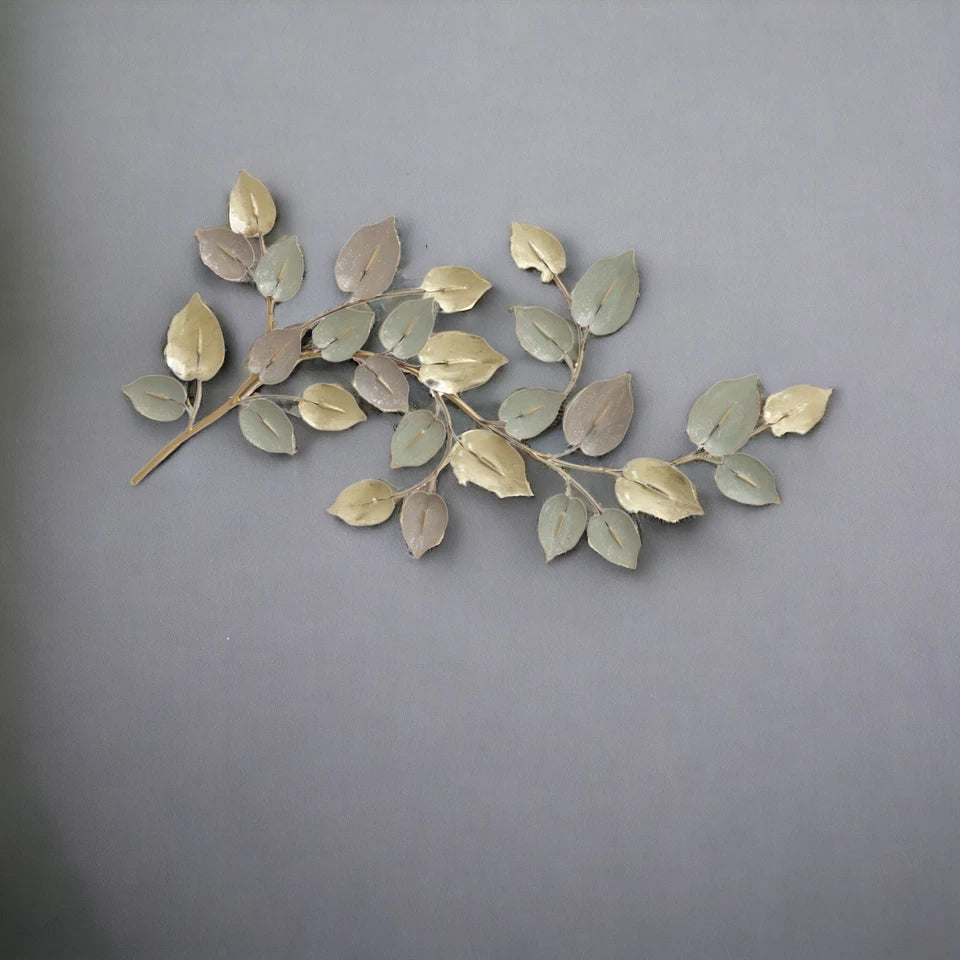 Modern botanical metal wall sculpture with golden leaves