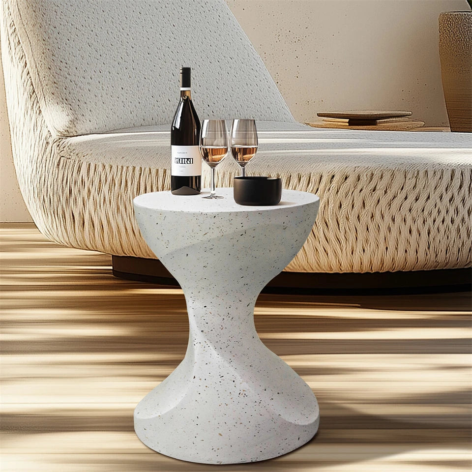 Sculptural white concrete side table with hourglass design