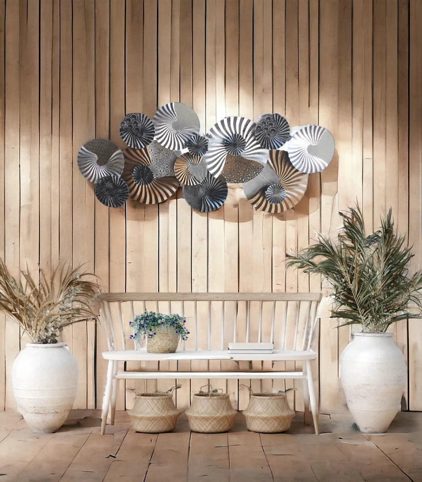 Modern spiral metal wall décor with textured circular design