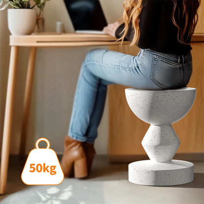White sculpted end table for living room or outdoor patio