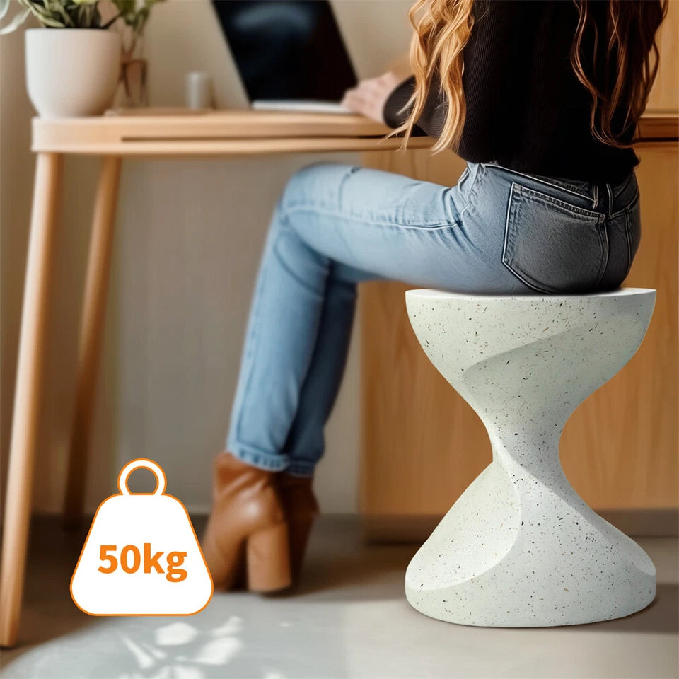 Minimalist white concrete end table with unique shape