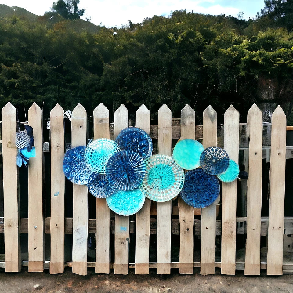Contemporary blue metal wall art with layered circle design