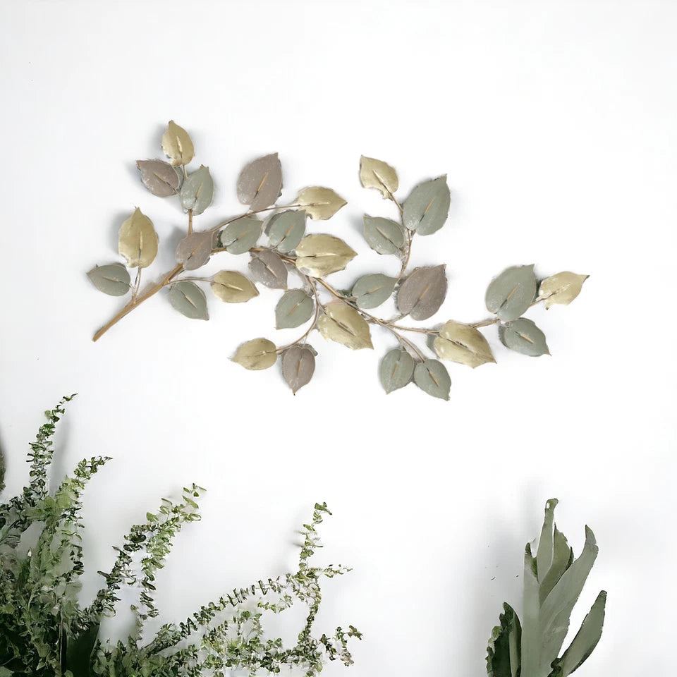 Nature-inspired golden leaf wall décor for living room